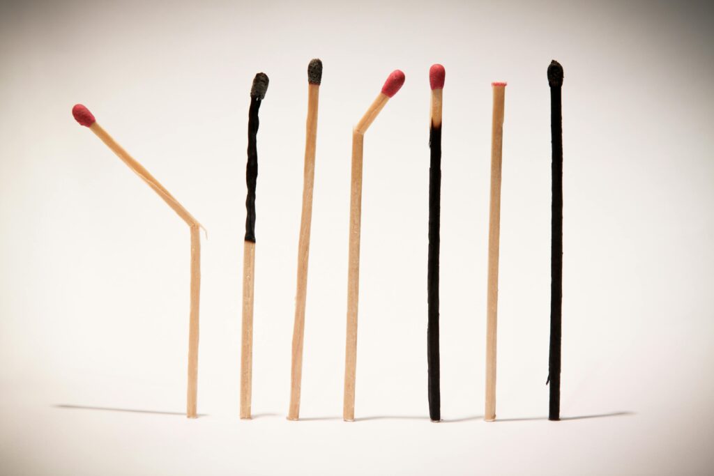 Creative display of matches in various stages of burning, symbolizing transformation.